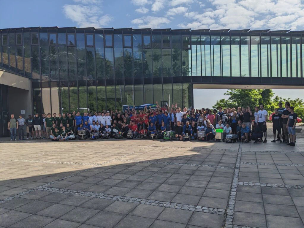 All teams with their robots in front of the University of Maribor